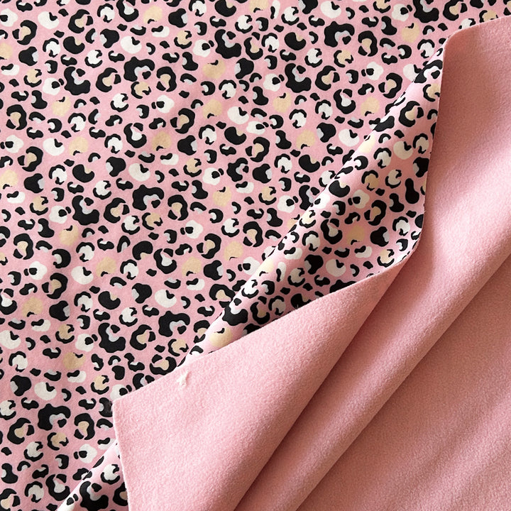 Tissu softshell rose tâches noires