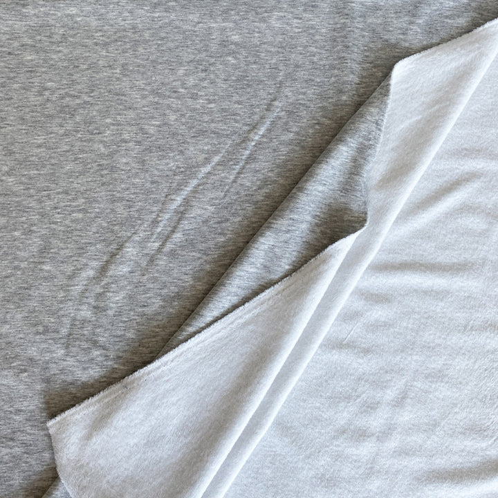 Sweat double face gris chiné clair poil blanc